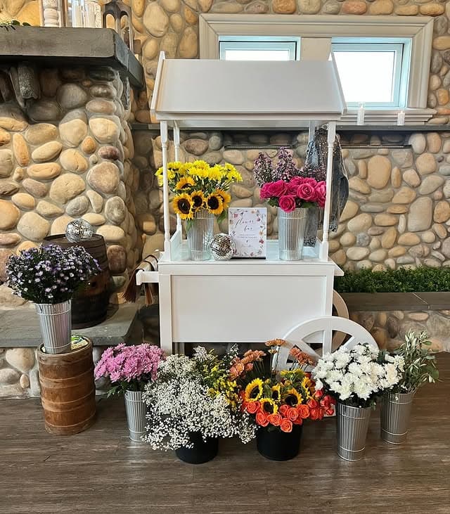 White DIY bouquet cart filled with fresh flowers